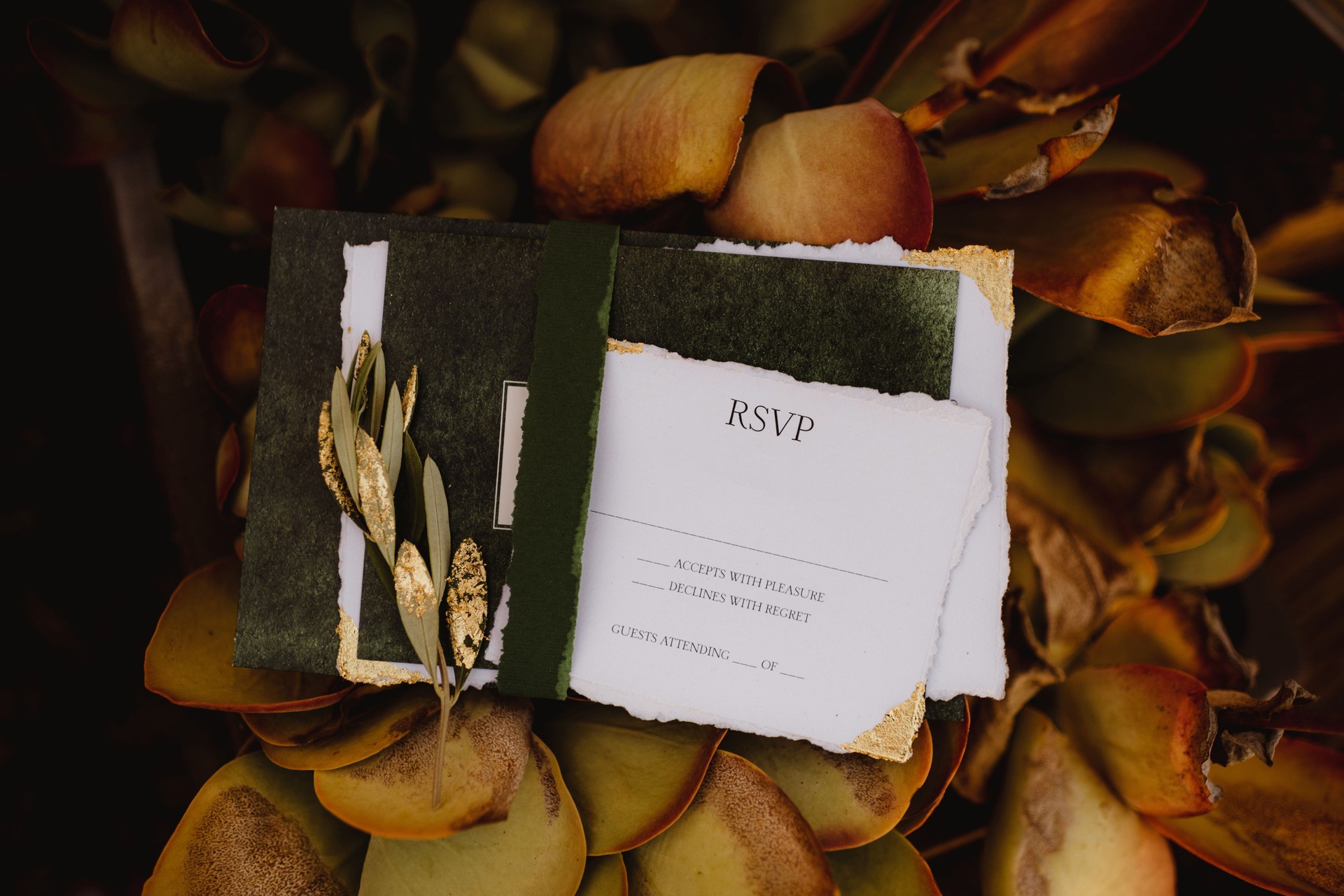Wedding invitation and RSVP with green and gold accents and elegant gold leaf